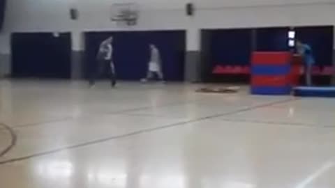 Man in blue tries to jump over stacked mats faceplants