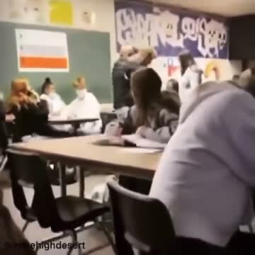 Teacher forcefully carries a student out of class for not wearing a face mask