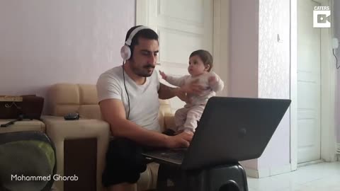 Baby Distracts Dad From Work