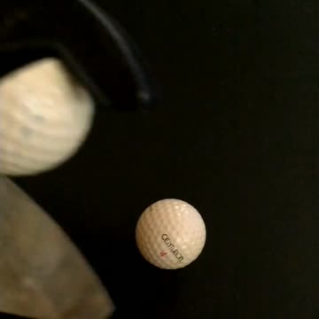 Using ratcheting landscaping pruner to cut open a golf ball.