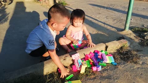 The children are playing in the garden