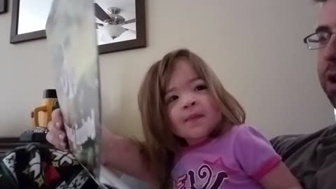 Little Girl Loves “Pooping Pooches” Calendar