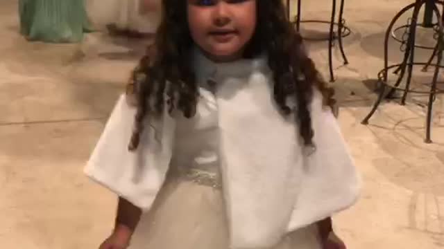 beautiful child dancing at the wedding
