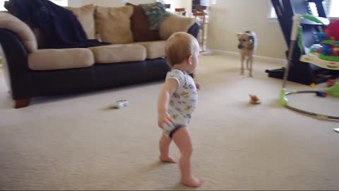 Little girl moves her entire body into floor puddle