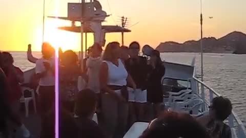 Booze cruise dance the Macarena