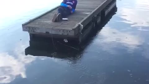 Guy purple shirt getting beer tossed at