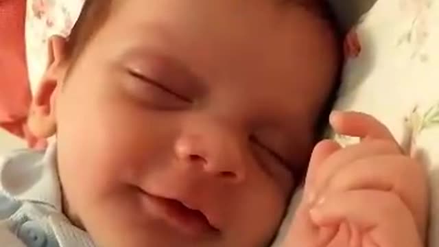 watch the sleeping laughing baby
