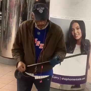 Old man hat brown jacket dancing