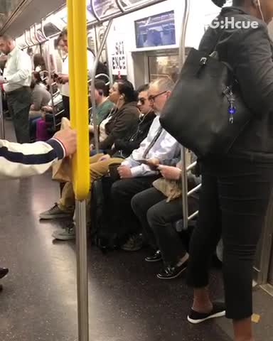 Man in suit drinks coffee from army mug