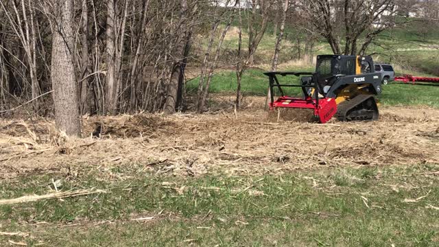 John Deere with Forestry Mower Attachment