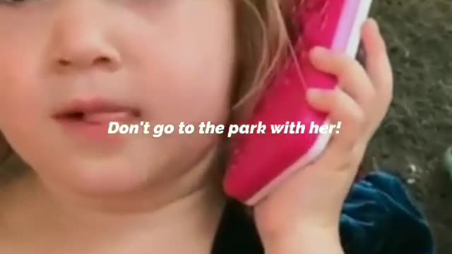 Cute Baby girl talking On the mobile phone having a serious call