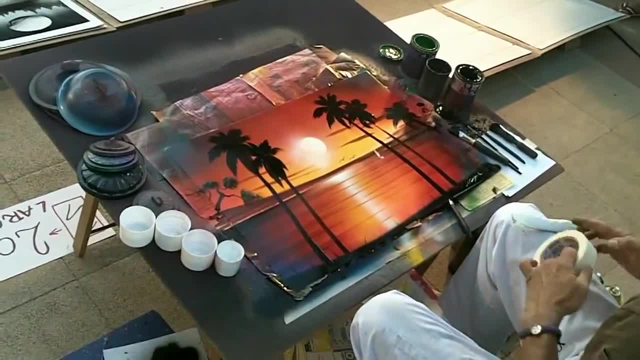 Street artist making an amazing work of art!