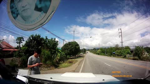 Tire Rolls Across Road