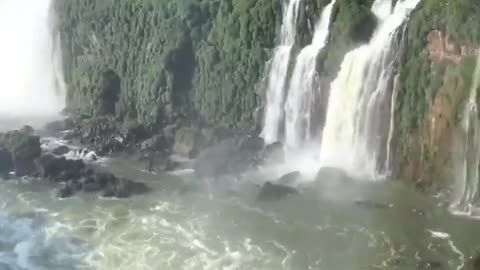 THIS IS LGUAZU FALLS IN SOUTH AMERICA WHERE 275 WATERFALLS CASCADE DOWN TOGETHER ~THE LARGEST WATERFALL SYSTEM IN THE WORLD