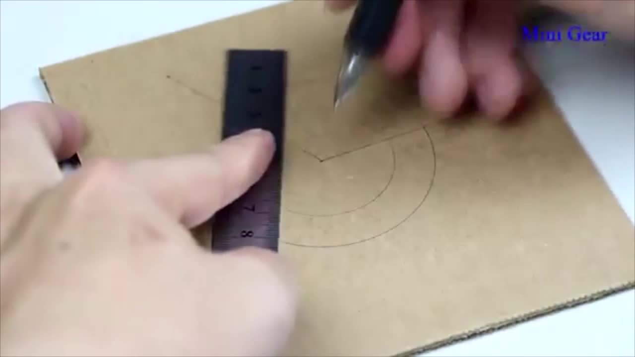 Draw Two Circles With Different Diameter And Length On The Cardboard