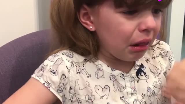 The cute little girl pierced her ears for the first time, crying so distressed!