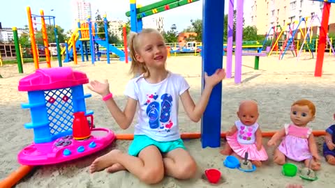 Polina playing cooking with toy kitchen