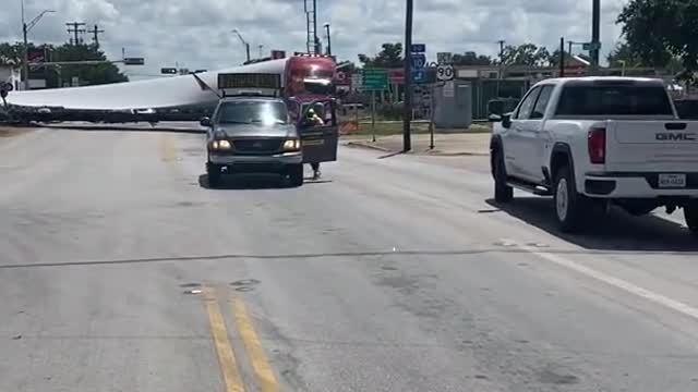 Train Cuts Through Wind Blade at Crossing