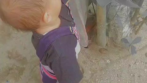 little cute man playing sand