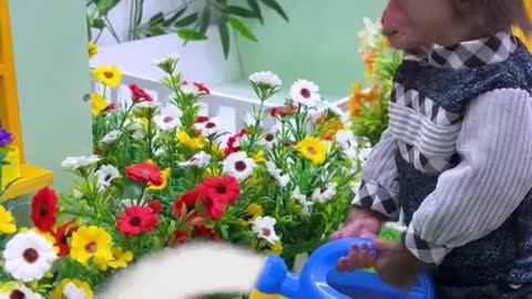 Monkey is applying water to the flowerbed