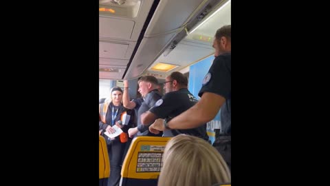 Passengers Cheer as Police Kick Man off the Plane