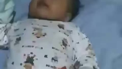 Our few months old baby singing with mummy