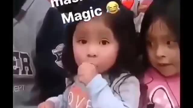 Small Child Demonstrates Magic w/Mask