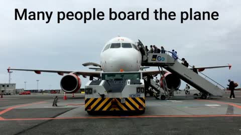 Many people board the plane