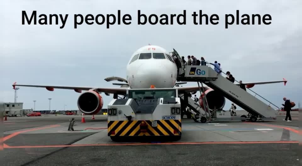 Many people board the plane