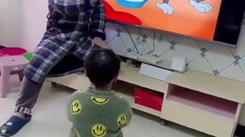 Son has fun with father's creativity