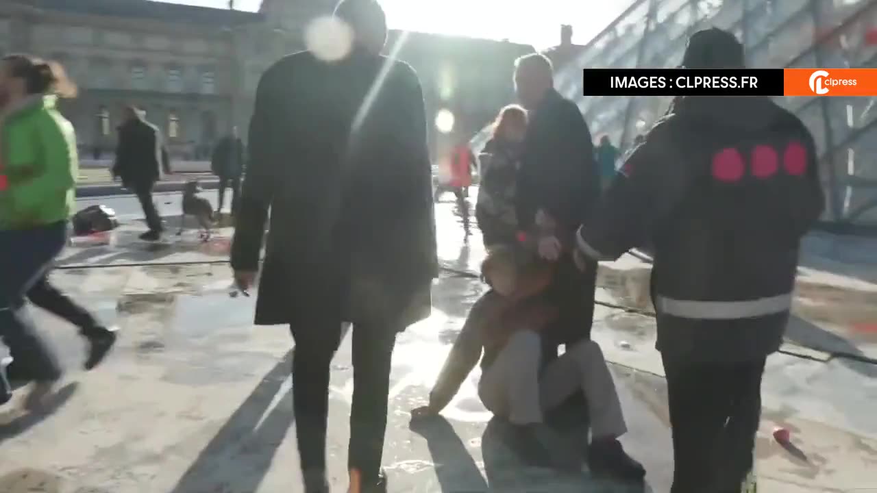 NOW - Climate radicals attack the Louvre Pyramid in Paris.