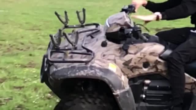 Man on camouflage motorcycle flips over slow motion