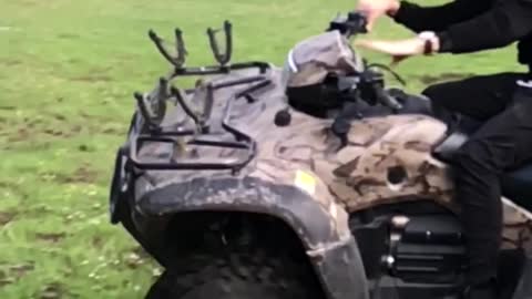 Man on camouflage motorcycle flips over slow motion