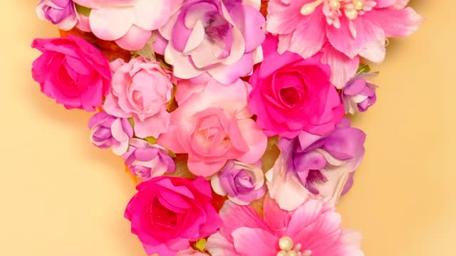 A slice of flower pizza on a yellow background