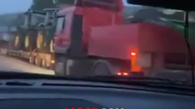 RUSSIAN POLICE ESCORT CHECHEN KADYROVS AS THEY TRANSPORT TRACTORS AND OTHER AGRICULTURAL MACHINERY STOLEN FROM UKRAINE BACK TO THEIR HOME COUNTRY OF CHECHNYA