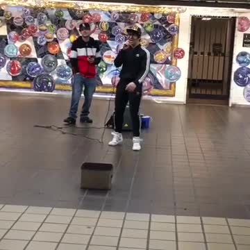 Two guys rapping about grilled cheese in subway