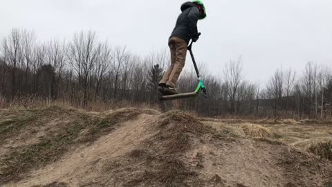 Epic Scooter Trick on Frozen Dirt Jumps