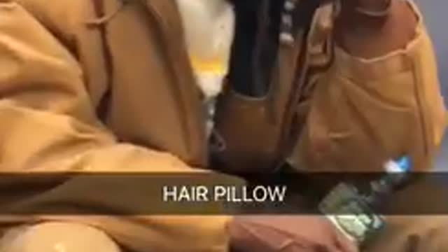 Hair pillow man in brown leans head agains handful of hair