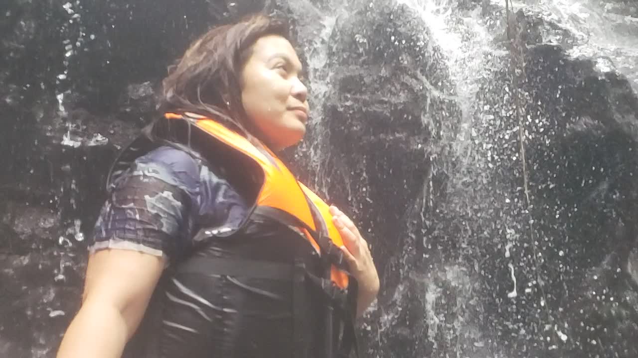 Standing Under A Waterfall - A Slow Mo Video