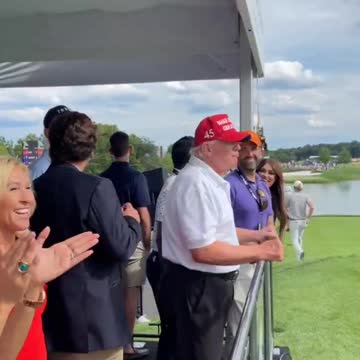 Trump, Tucker Carlson and MTG laughing together as the crowds at the golf chant "let's go Brandon".