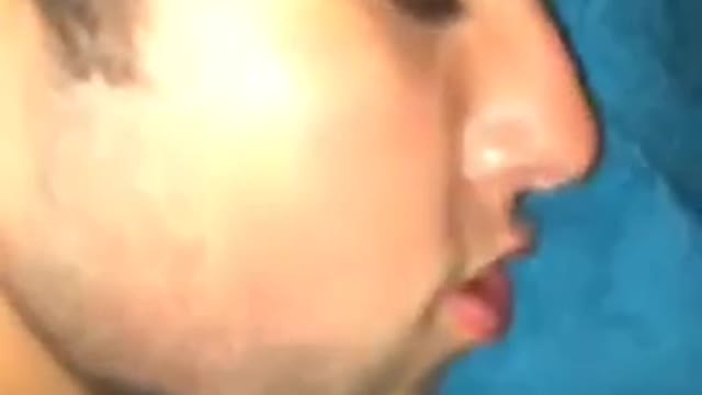 Drunk guy laying in bed next to trash can with pink bra on back dakota