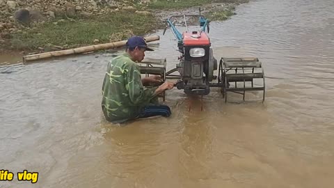 the ddan man has just come back from plowing and washing machines