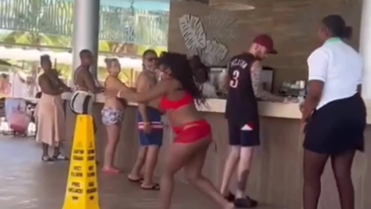 Tourist thinks she can throw her drink on worker without repercussions. She was wrong.