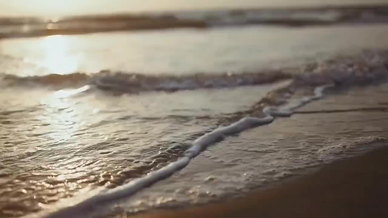 The sea comes up to take away the imprint of the beach