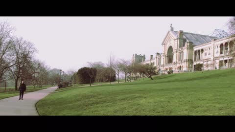 Woman walking through a park