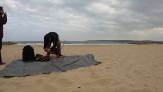 Setting up to sit on a sandy beach. Bournemouth . Speedlapse. GoPro