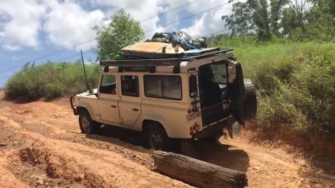 White jeep uphill backdoor open