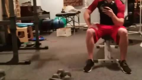 Black lab working out on a treadmill owner filming in gym