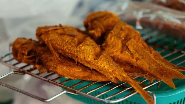 fried fish in a street shop