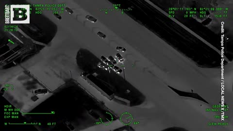 Man Fleeing Traffic Stop Cracks Up Officers as He Ditches Rifle & "Bottle of Hennessy"